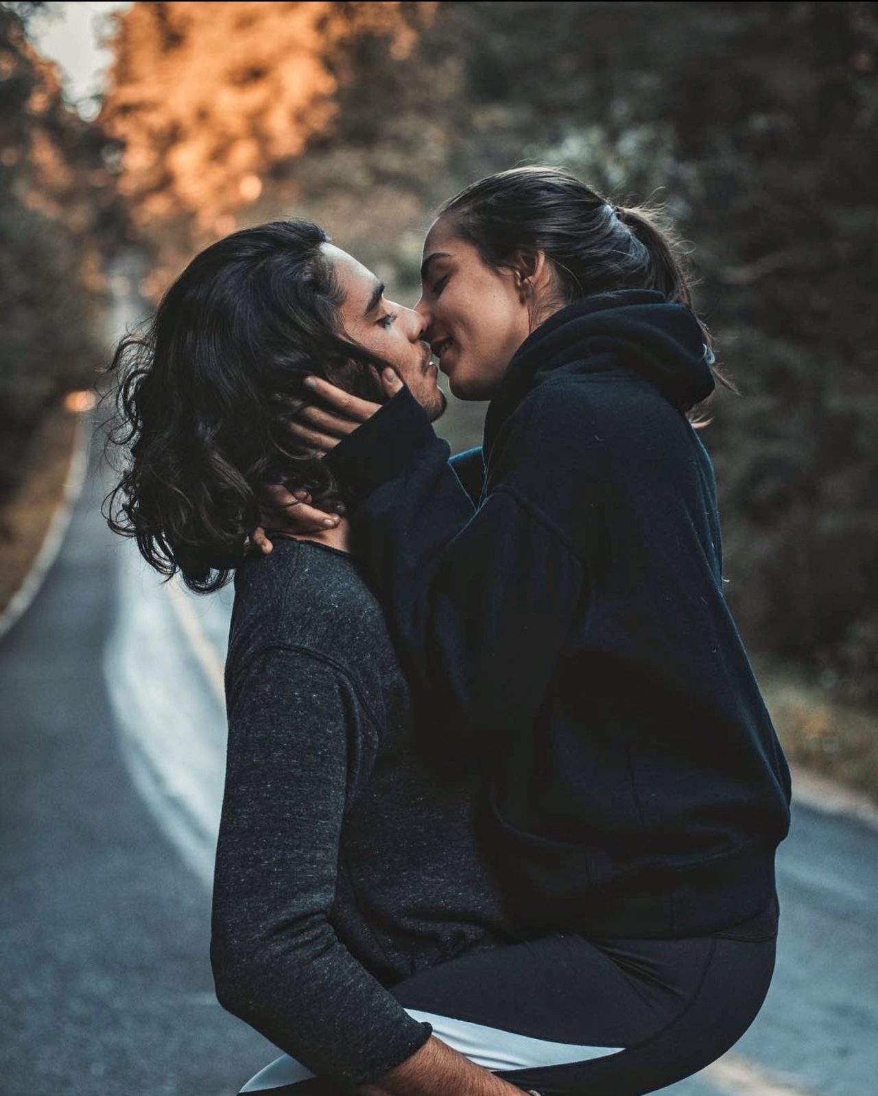 man and woman kissing