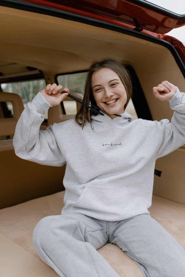 Happy Girl in Be Kind Sweatshirt