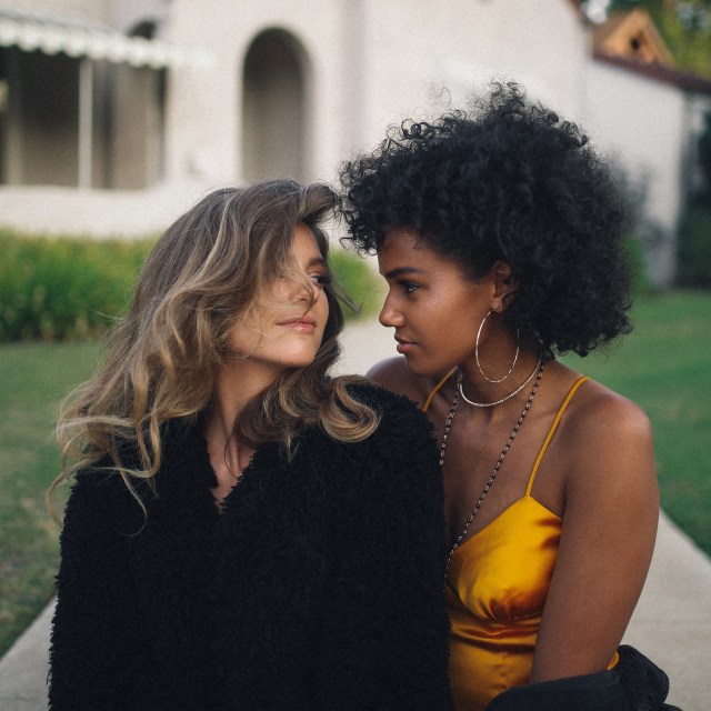 Brunette & Blonde Best Friends Looking at Each Other