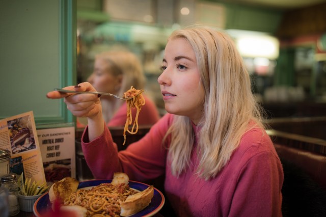 woman eating pasta