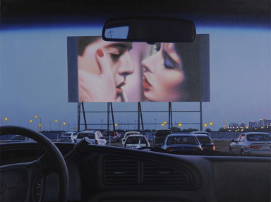 View from inside a car at a drive-in theater at dusk, with a large screen showing two people about to kiss and rows of parked cars below.