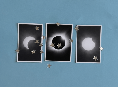 Three eclipse phase photos on blue background surrounded by silver star confetti, showing partial crescent, full totality with corona, and partial phase.