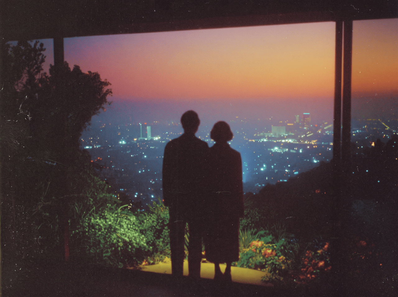 Illustration of a couple looking out over city lights at dusk.