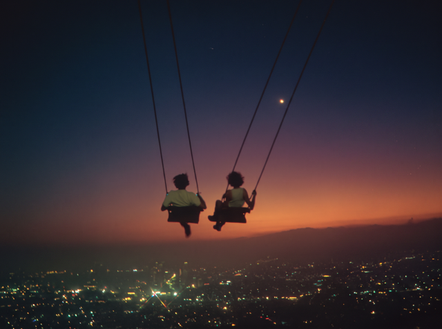 Illustration of two people on swings above a city at sunset.